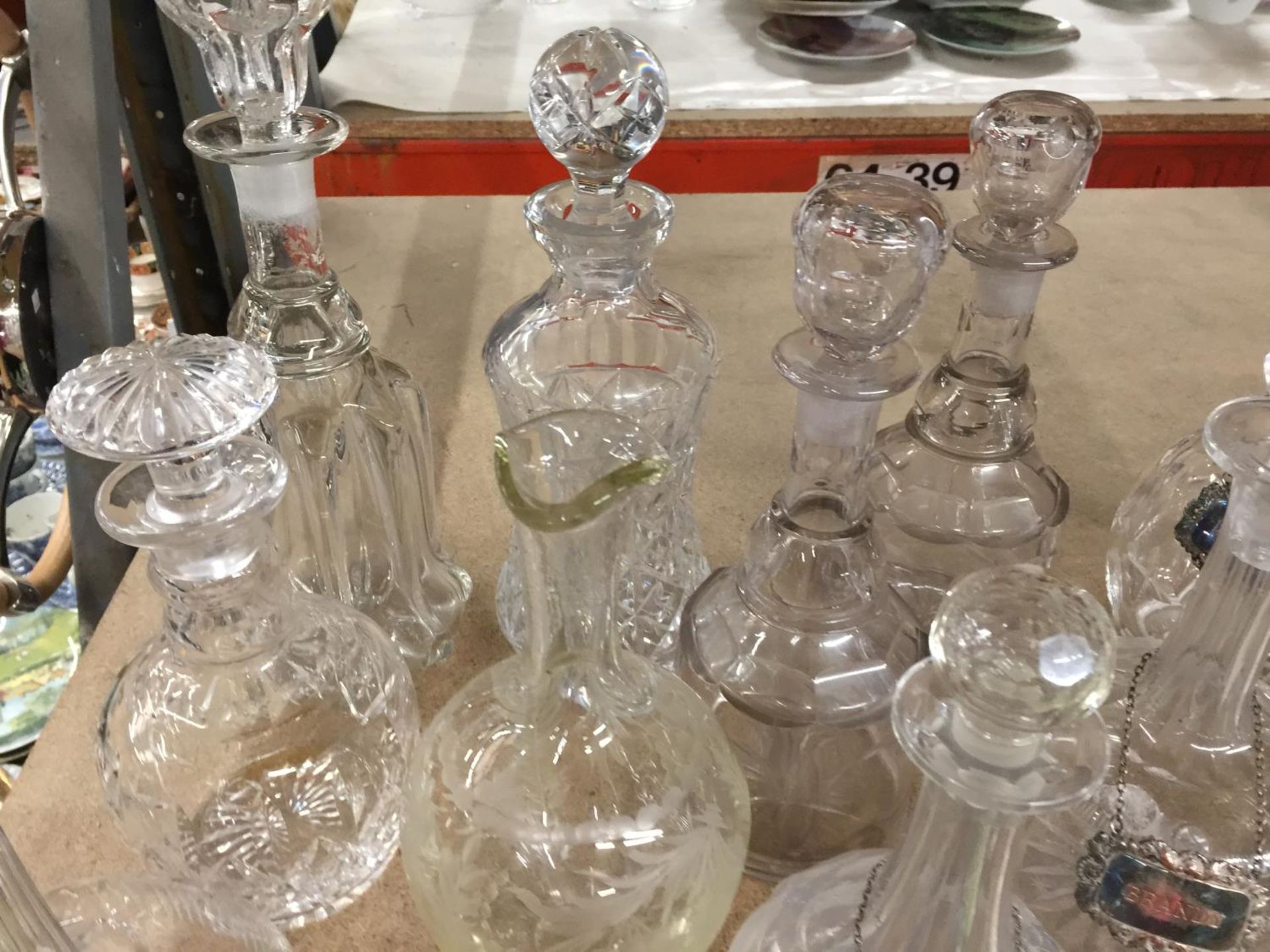A QUANTITY OF GLASSWARE INCLUDING MAINLY DECANTERS, SOME WITH NAME TAGS PLUS A SCENT BOTTLE, BISCUIT - Image 5 of 6