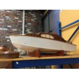 A LARGE MODEL OF A WOODEN SPEED BOAT 'SEA QUEEN' ON A WOODEN BASE. LENGTH 120CM APPROX, HEIGHT