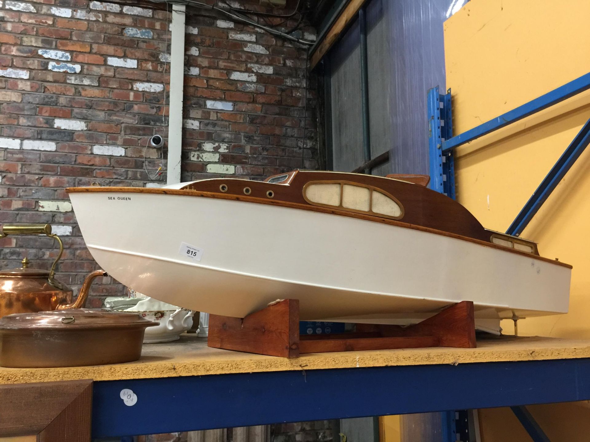 A LARGE MODEL OF A WOODEN SPEED BOAT 'SEA QUEEN' ON A WOODEN BASE. LENGTH 120CM APPROX, HEIGHT