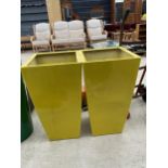 A PAIR OF YELLOW FIBRE GLASS PLANTERS (H:73CM)