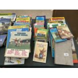 A LARGE ASSORTMENT OF CHILDRENS BOOKS AND ANNUALS TO INCLUDE RUPERT ETC