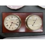 A MAHOGANY FRAMED WALL MOUNTED CLOCK AND HYGROMETER