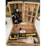 A SMALL KIBRO MICROSCOPE WITH VARIOUS TOOLS AND A SMALL BRASS VINTAGE MICROSCOPE