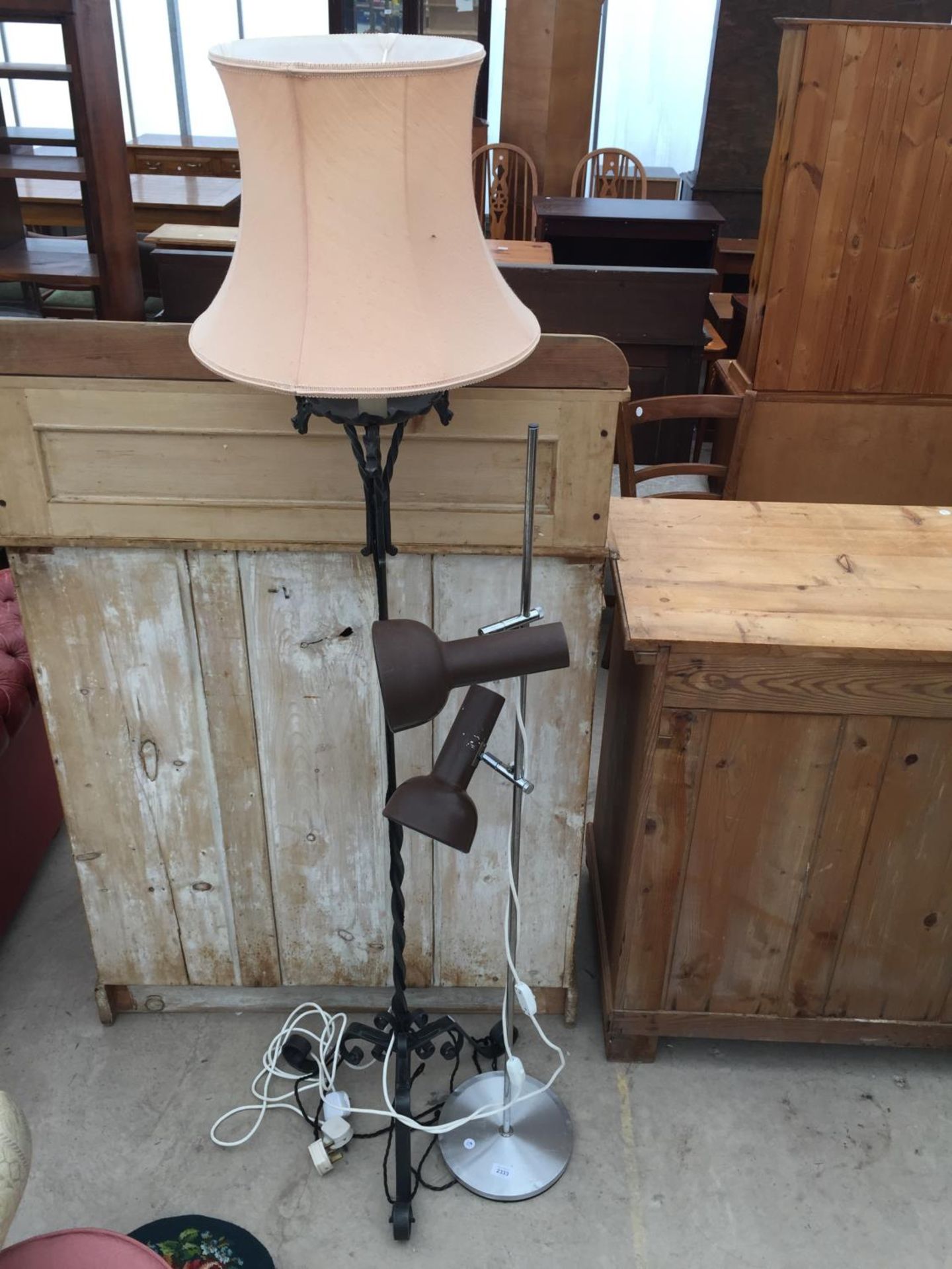 A WROUGHT IRON STANDARD LAMP COMPLETE WITH SHADE AND ONE OTHER LAMP