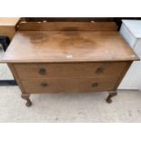 AN EARLY 20TH OAK CHEST OF TWO DRAWERS, ON CABRIOLE LEGS