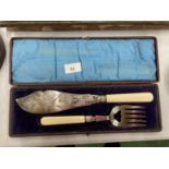 A VINTAGE BOXED FISH CARVING SET