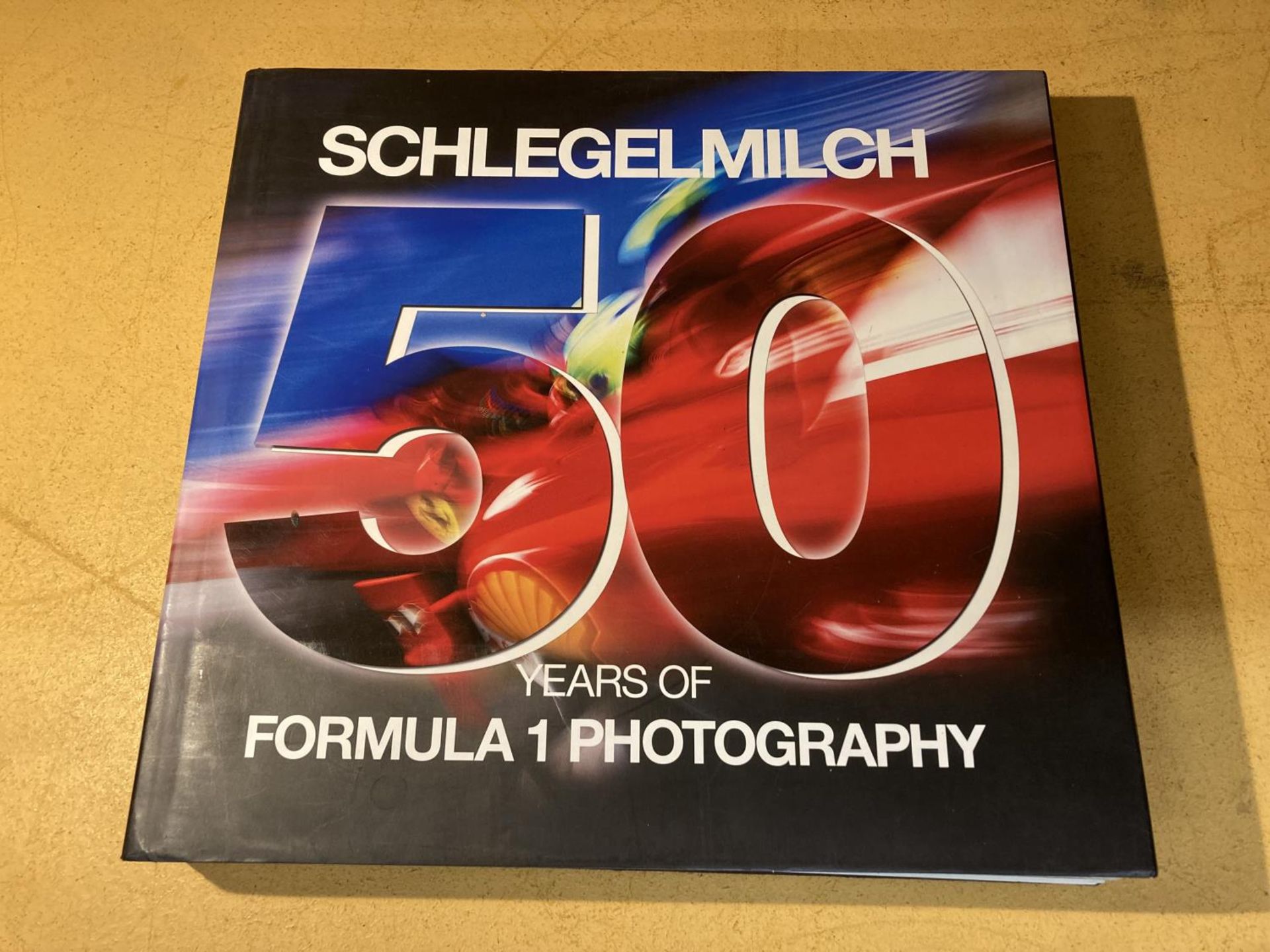 SCHLEGELMILCH 50 YEARS OF FORMULA 1 PHOTOGRAPHY (SPANISH AND ENGLISH EDITION) - 2012 FOLIO SIZED,