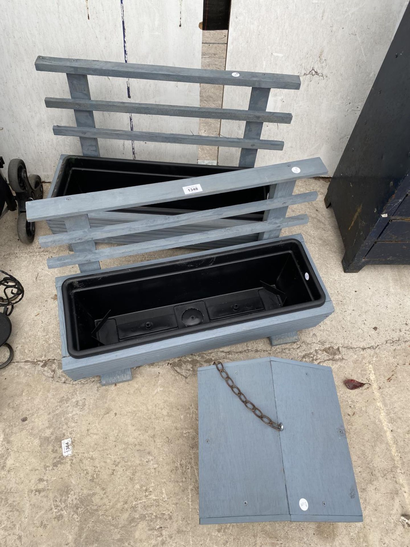 TWO WOODEN PLANTERS WITH PLASTIC INSERTS AND A WOODEN BIRD TABLE TOP