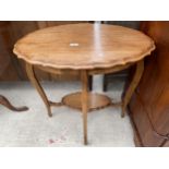AN OVAL EDWARDIAN TWO TIER CENTRE TABLE