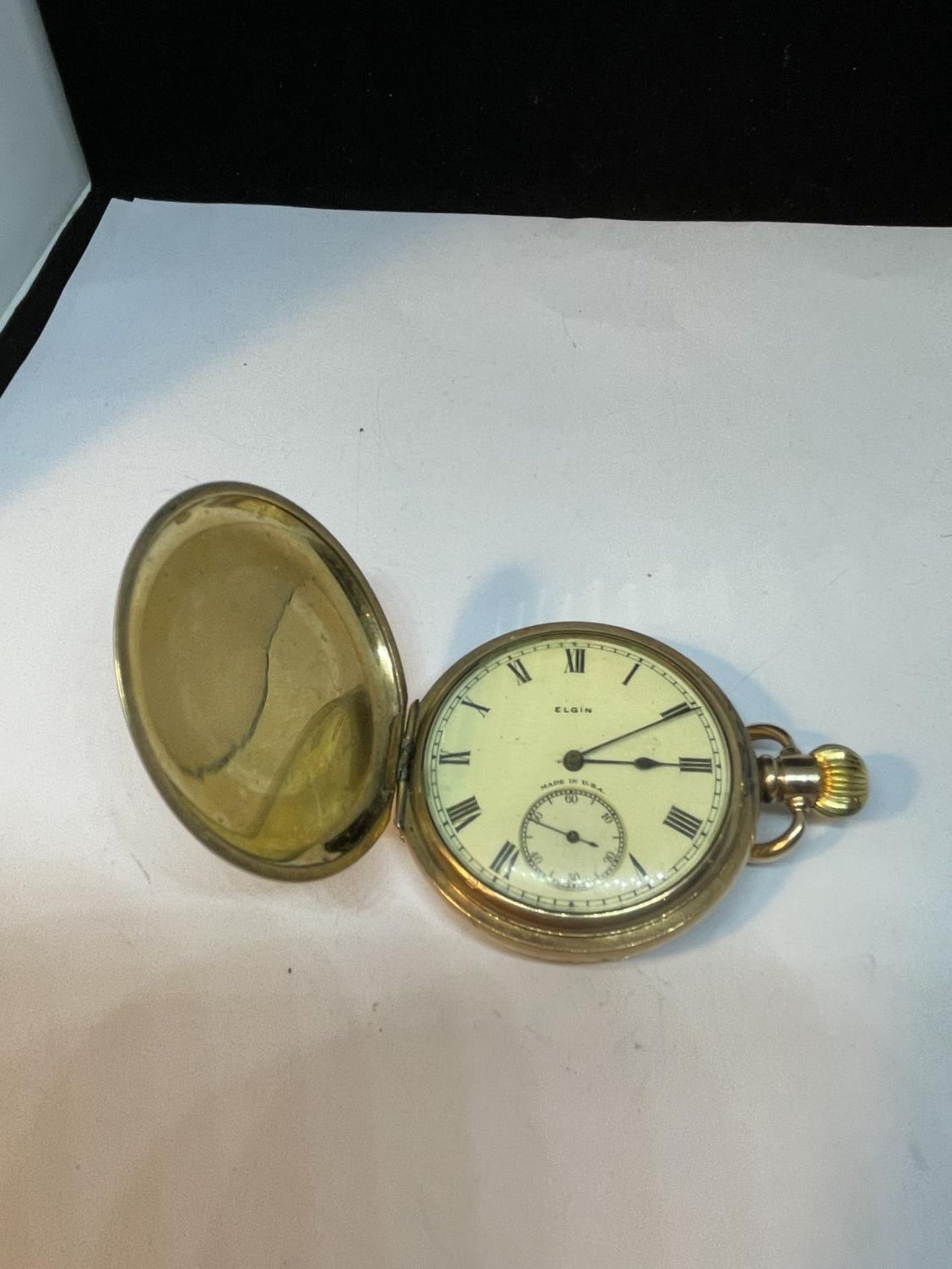 A GOLD PLATED ELGIN POCKET WATCH SEEN WORKING BUT NO WARRANTY
