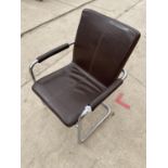 AN ITALIAN FAUX LEATHER ELBOW CHAIR ON TUBULAR CHROME FRAME