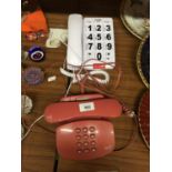 A BT SALMON PINK PHONE AND A LARGE BUTTON PHONE