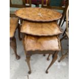 A NEST OF THREE WALNUT TABLES