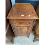 A VICTORIAN WALNUT POT CUPBOARD WITH PANELLED DOOR AND RAISED BACK