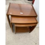 A RETRO TEAK NEST OF THREE TABLES