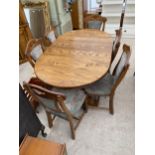 AN OAK EXTENDING DINING TABLE AND SIX CHAIRS