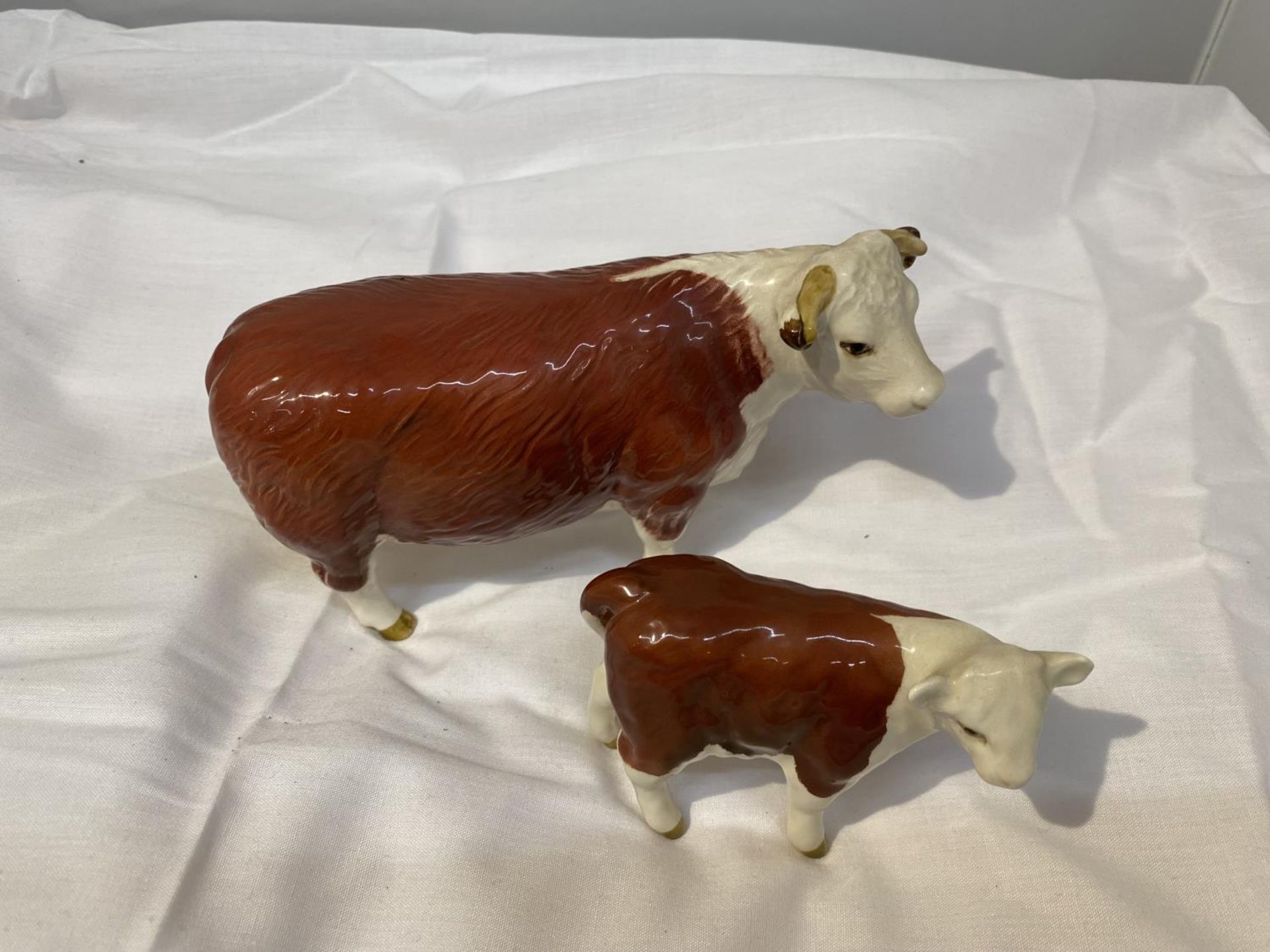 TWO BESWICK FIGURES, A HEREFORD COW AND A CALF - Image 2 of 8