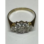 A 9 CARAT GOLD RING WITH NINE CLEAR STONES IN A DIAMOND FORMATION SIZE O/P