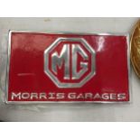 A CHROME AND RED MG MORRIS GARAGES SIGN 29CM X 17CM