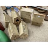 A COLLECTION OF SIX WOODEN BIRD BOXES