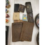 A COLLECTION OF LEATHER PURSES, WALLETS, ETC