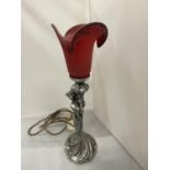 AN ART DECO STYLE PEWTER TABLE LAMP WITH A RED GLASS SHADES