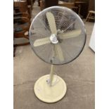 A CREAM UPRIGHT FLOOR FAN