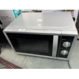 A SILVER MORPHY RICHARDS MICROWAVE OVEN