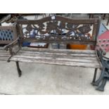 A WOODEN SLATTED GARDEN BENCH WITH CAST IRON BENCH ENDS AND BACK