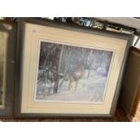 A LARGE FRAMED LIMITED EDITION PRINT OF A LONE WOLF IN A WINTER SETTING SIGNED J. R. GILKES W: 74CM