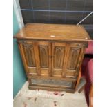 A DARK OLD CHARM ANTIQUE STYLE TV CABINET