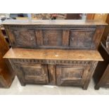 A 17TH CENTURY OAK COURT CUPBOARD, WITH CARVED PANEL DOORS TO THE UPPER AND LOWER SECTIONS, 57" WIDE