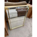 A MODERN GILT FRAMED WALL MIRROR, 35X25"