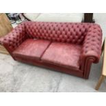 A RED LEATHER CHESTERFIELD SETTEE