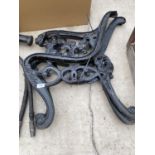 A PAIR OF DECORATIVE CAST IRON BENCH ENDS WITH LION HEAD DETAIL