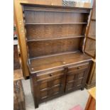 A REPRODUCTION OAK DRESSER COMPLETE WITH RACK, 47" WIDE