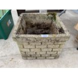 A RECONSTITUTED STONE PLANTER