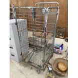 A VINTAGE METAL LAUNDRY CAGE ON WHEELS