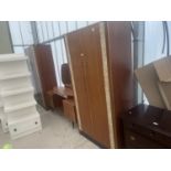 A RETRO TEAK AND MARBLE EFFECT THREE PIECE BEDROOM SUITE COMPRISING TWO WARDROBES AND A DRESSING