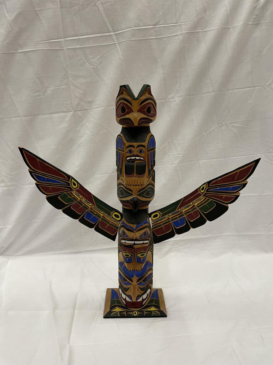 A MINIATURE 1ST NATION NOOKTKA TOTEM POLE SIGNED BY HARVEY WILLIAMS