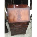 A REPRODUCTION MAHOGANY BUREAU ON BRACKET FEET, 20" WIDE