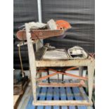 A LARGE INDUSTRIAL CAPPER SUPERIOR BLADE ROTATION TABLE SAW