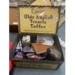 A VINTAGE LYONS' TREACLE TOFFEE TIN CONTAINING A QUANTITY OF COLLECTABLE ITEMS TO INCLUDE AN ACME