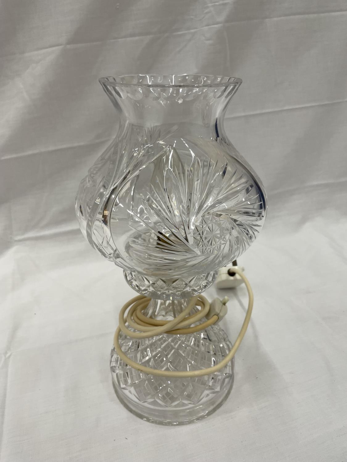 A CUT GLASS TWO PIECE HURRICANE LAMP 31CM TALL