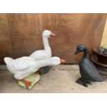 A PAIR OF RECONSTITUTED STONE GEESE AND A POT DUCK