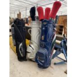 A COLLECTION OF VINTAGE GOLF BAGS AND GOLF CLUBS