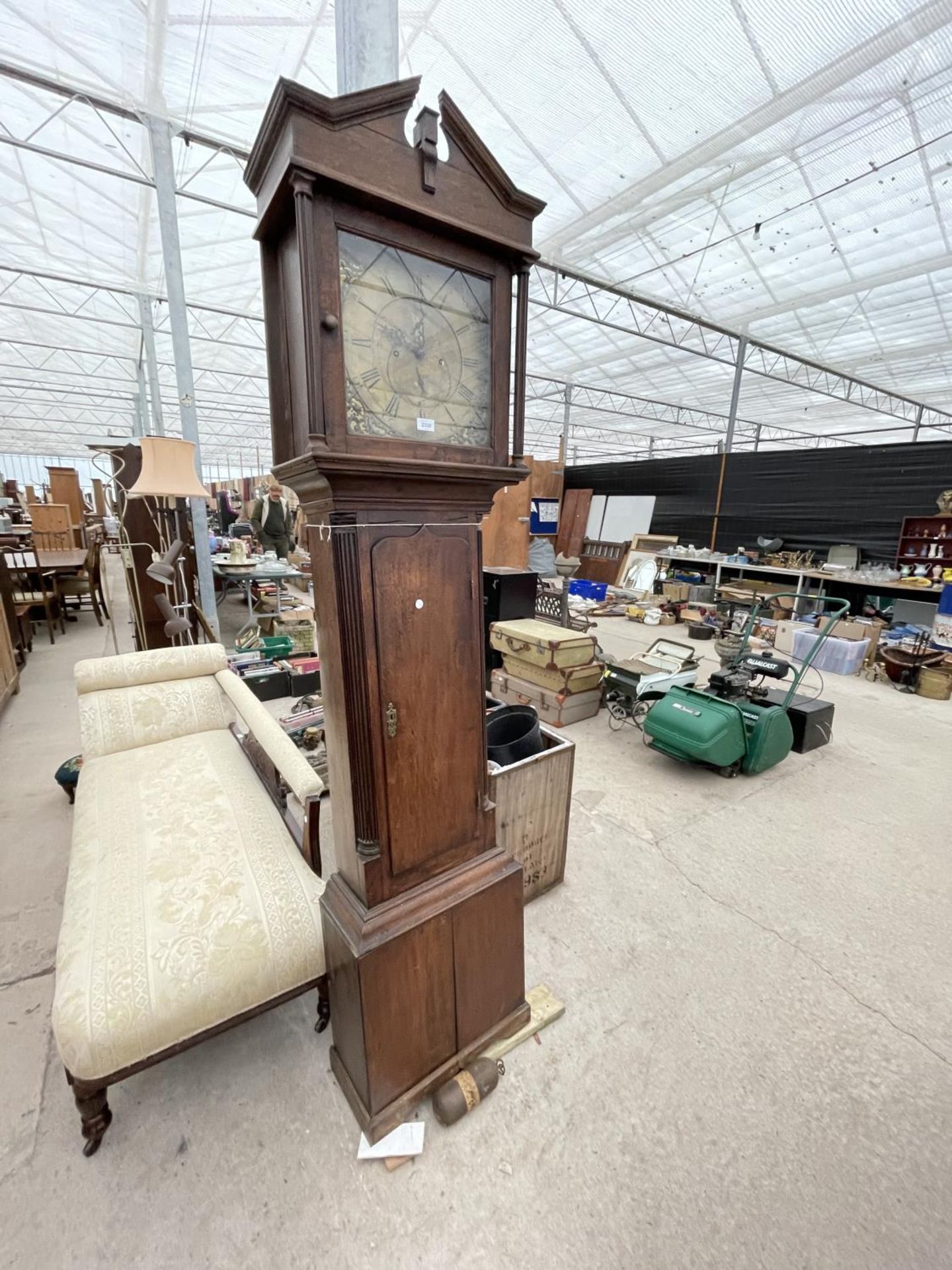 AN 18TH CENTURY OAK LONGCASE CLOCK BY FEARNLY, WIGAN, WITH SQUARE BRASS DIAL