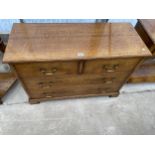 A GEORGE III STYLE LIGHT OAK CHEST OF TWO SHORT AND TWO LONG PARTITIONED DRAWERS, ON BRACKET FEET,