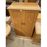 A MODERN OAK AND INLAID TWO DOOR CABINET, 28" WIDE