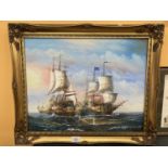 A GILT FRAMED OIL ON CANVAS OF TWO GALLEONS AT SEA SIGNED BY ARTIST J. HARVEY